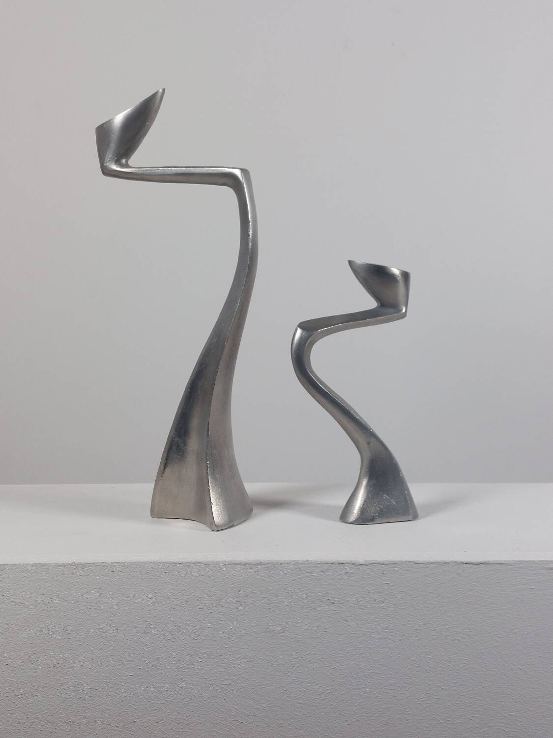 Pair of postmodern aluminium candlesticks by Matthew Hilton