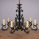 Black and gold patinated wrought iron chandelier – 10 lights – Louis XIV style