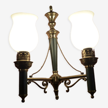 Brass wall sconce and frosted globe