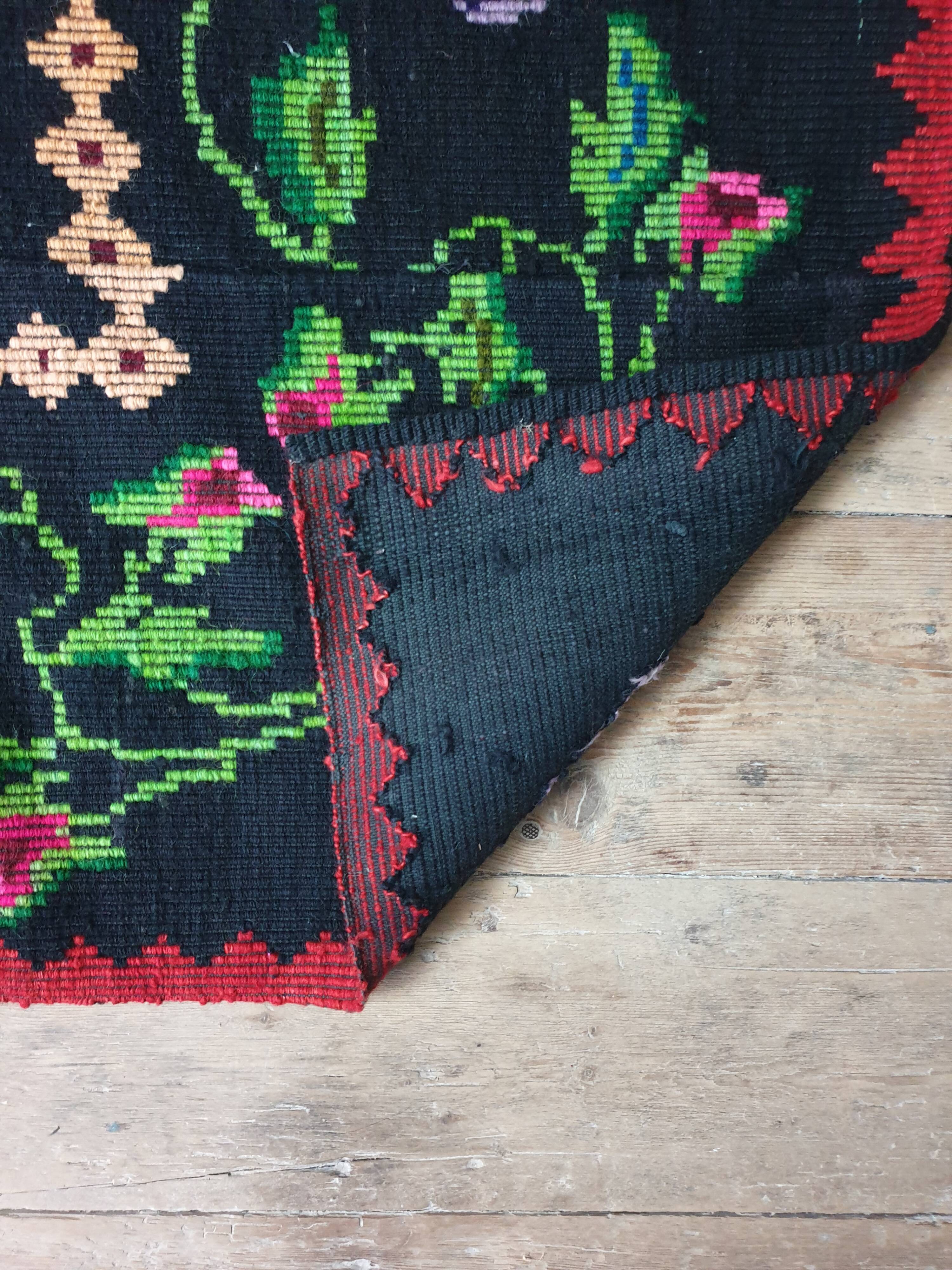 Vintage wool rug with floral design in sweet colors