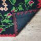 Tapis en laine vintage avec un design floral dans des couleurs douces