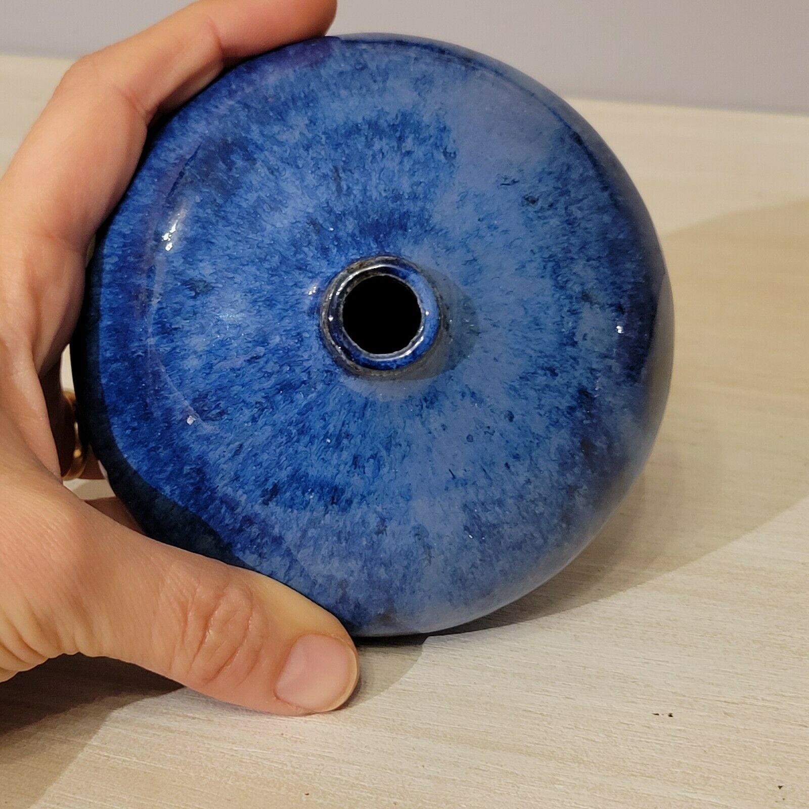 Small blue enamelled ceramic ball vase