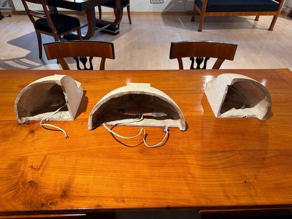 Art Deco wall lights in patinated plaster, France, 1925, set of 3