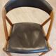Set of 6 vintage Kai Kristiansen chairs in solid teak and black faux leather.