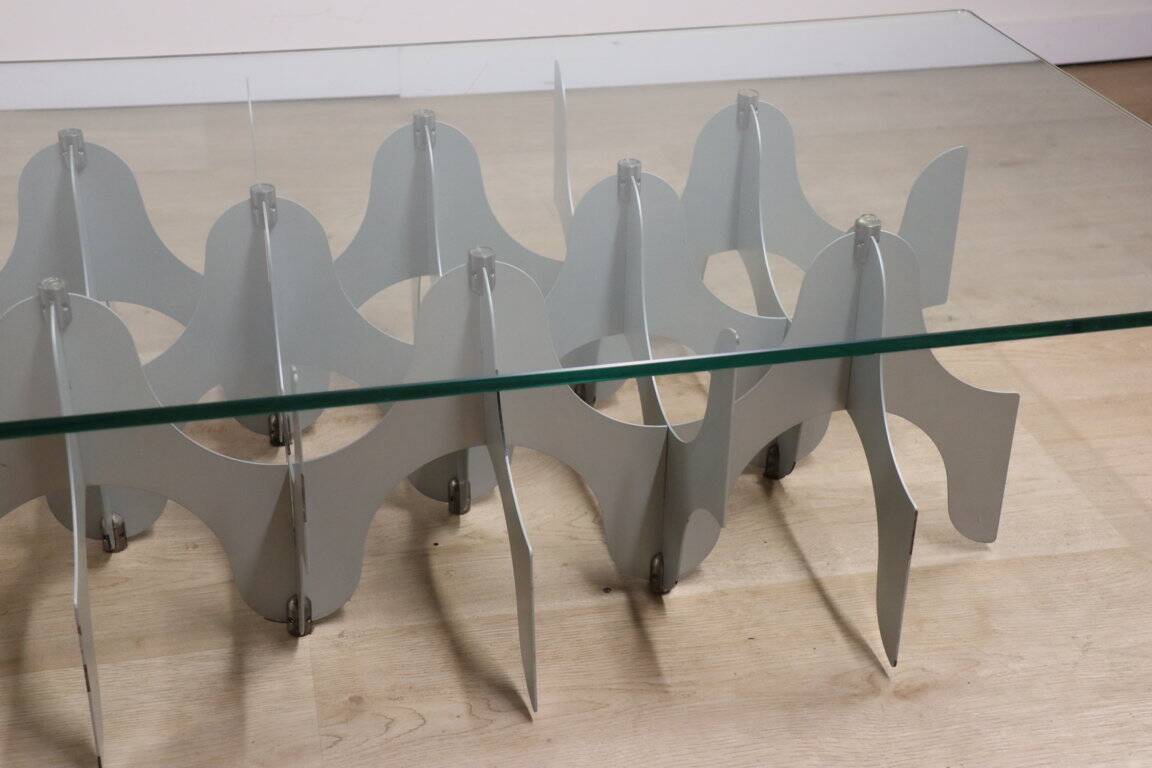 Minimalist sculptural coffee table in metal and glass