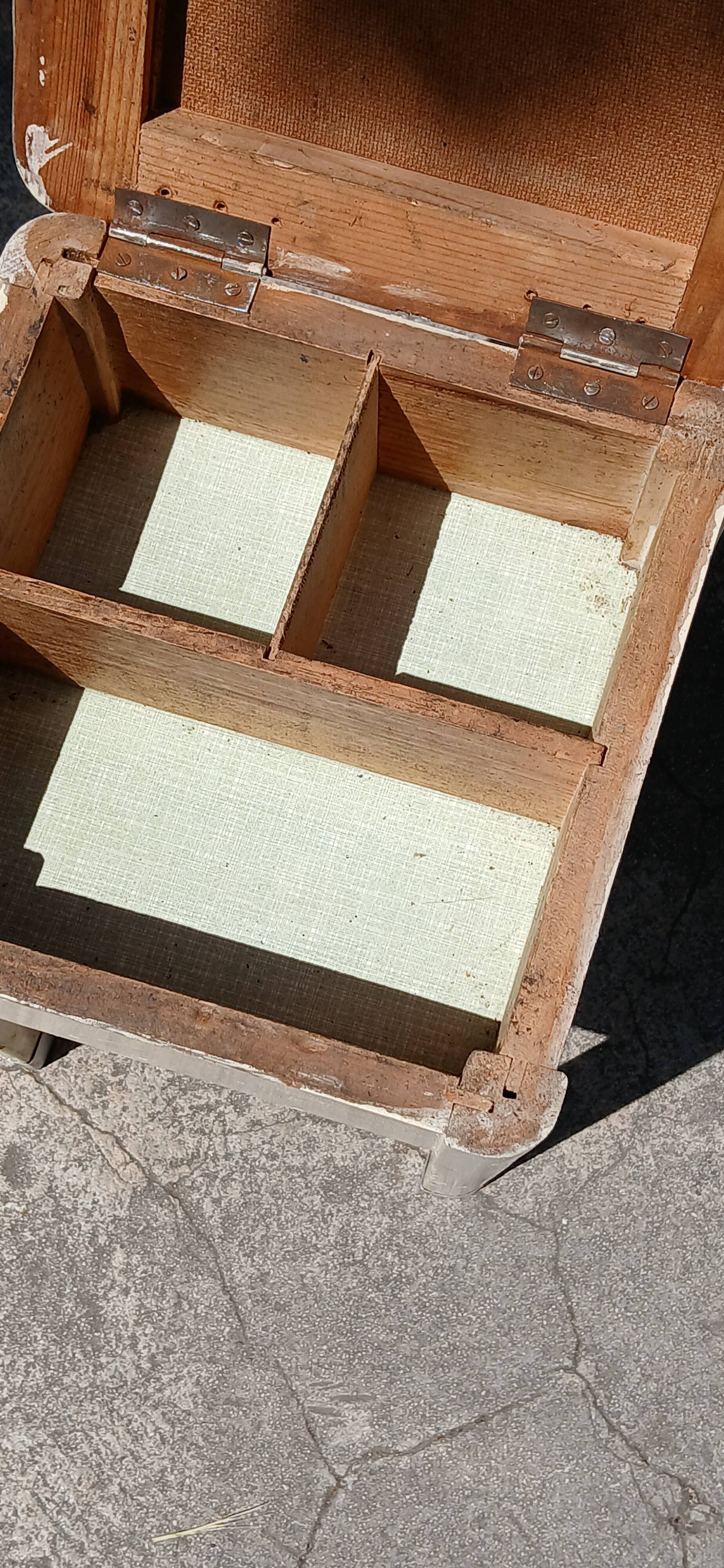 Shoe polish stool with round top and aluminum legs.