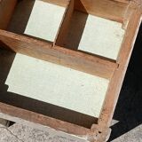 Shoe polish stool with round top and aluminum legs.