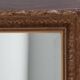 Miroir en bois stuc doré et verre biseauté