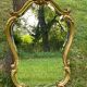 Beveled gilded wood mirror with violin shapes, Louis XV baroque style shell