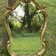 Beveled gilded wood mirror with violin shapes, Louis XV baroque style shell