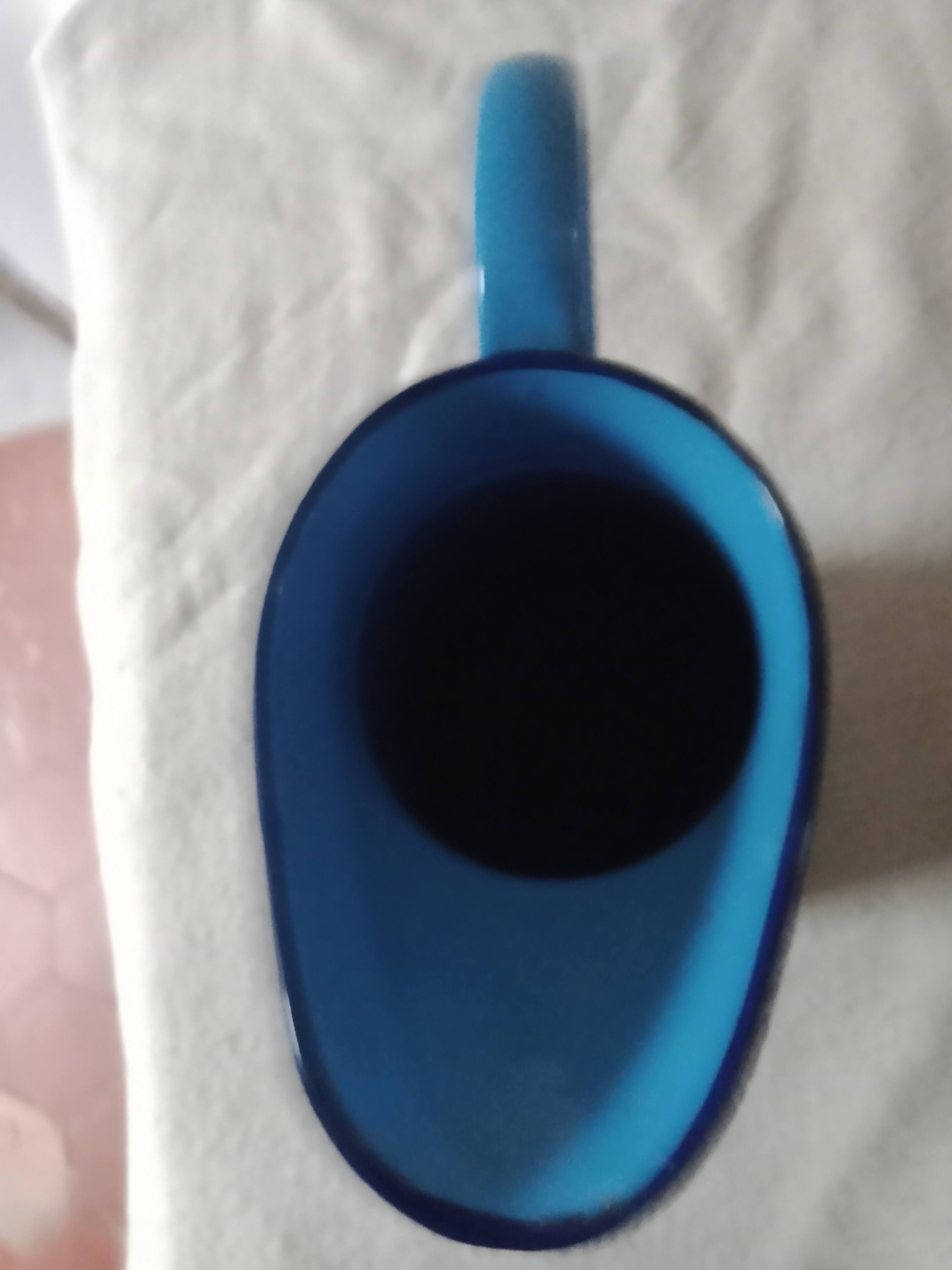 Old broc in blue enamelled sheet metal