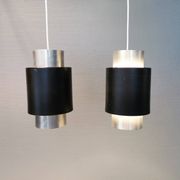 A set of beautiful cylinder shaped hanging lamps in silver color with black "ring" Danish 1970s.