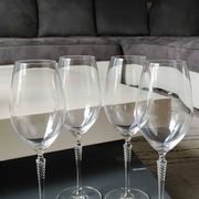Set of 4 large red wine glasses. With a long twisted stem. Signed Schott Zwiesel. High 27 cm