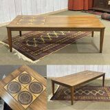 English coffee table in rosewood with tiled section from the 1970s.