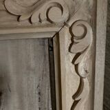 wooden painting with carved floral motif - note a restoration on the left side at the bottom.