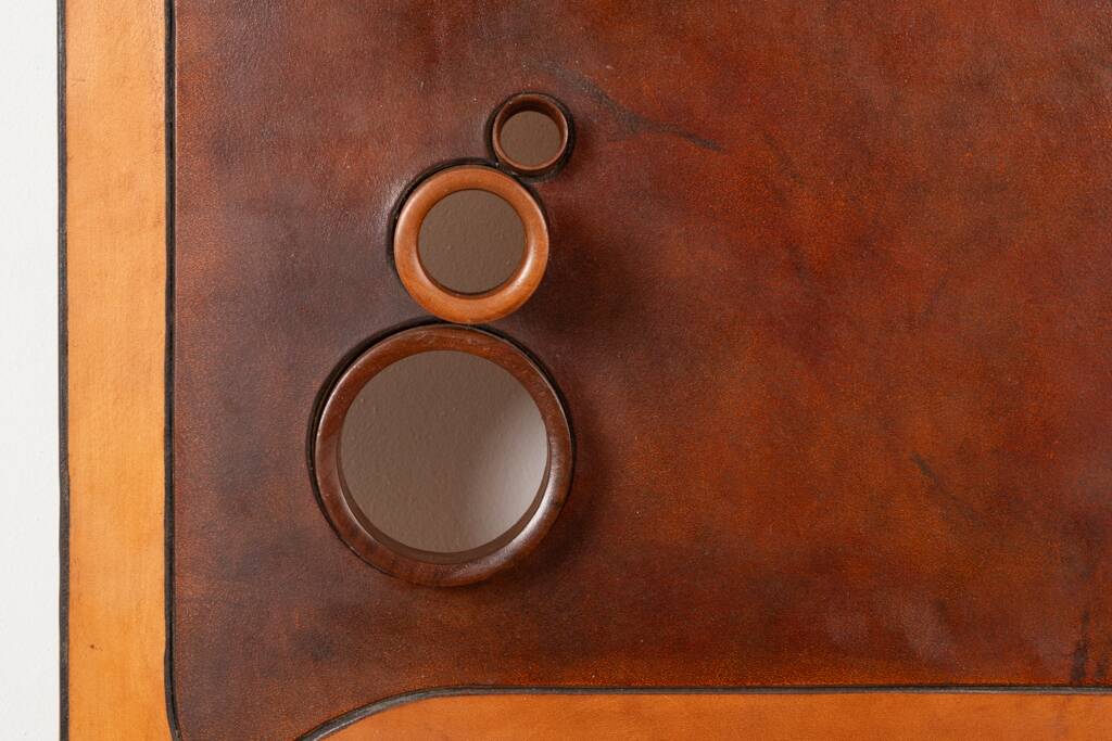 Stools and wall lights in cherry wood and leather. 1970s.