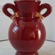 Vase St Clément bordeaux et doré années 50