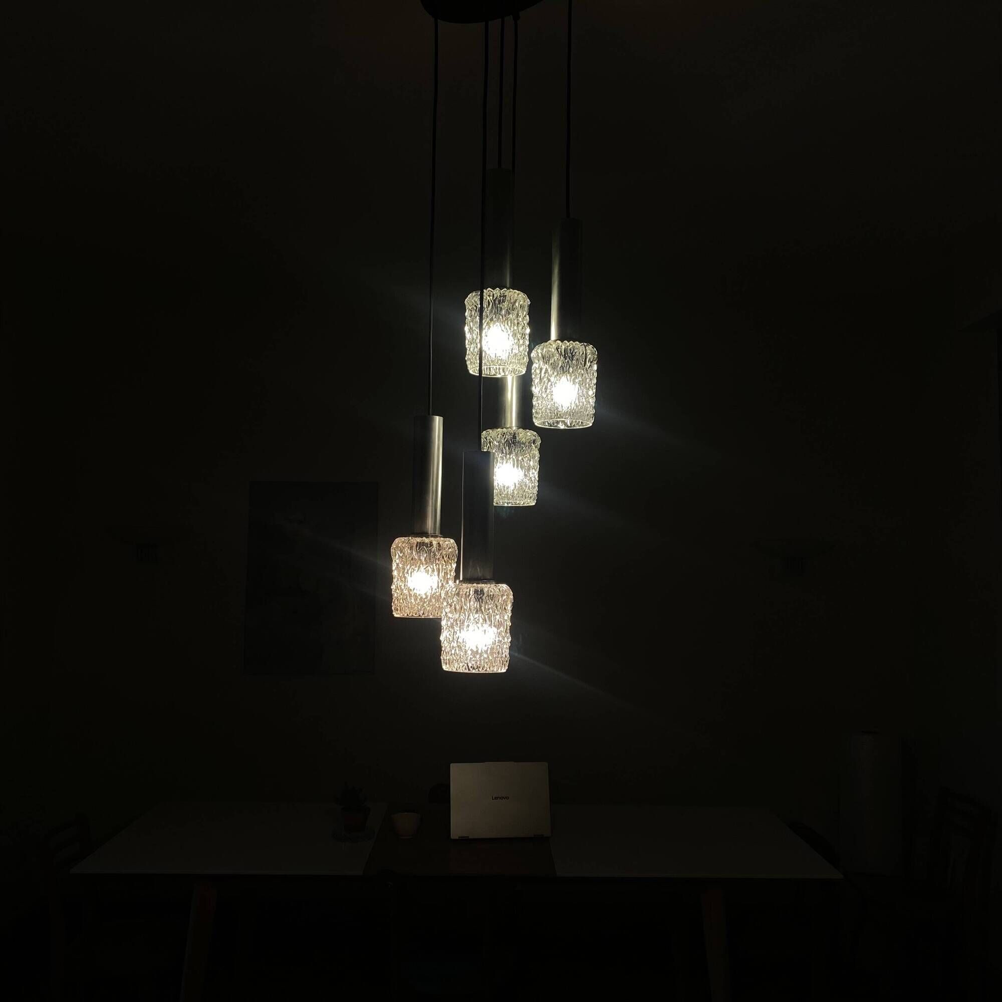 Large cascading chandelier with 5 glass lampshades and aluminium tube.