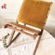 Old wooden rocking footrest with velvet fabric