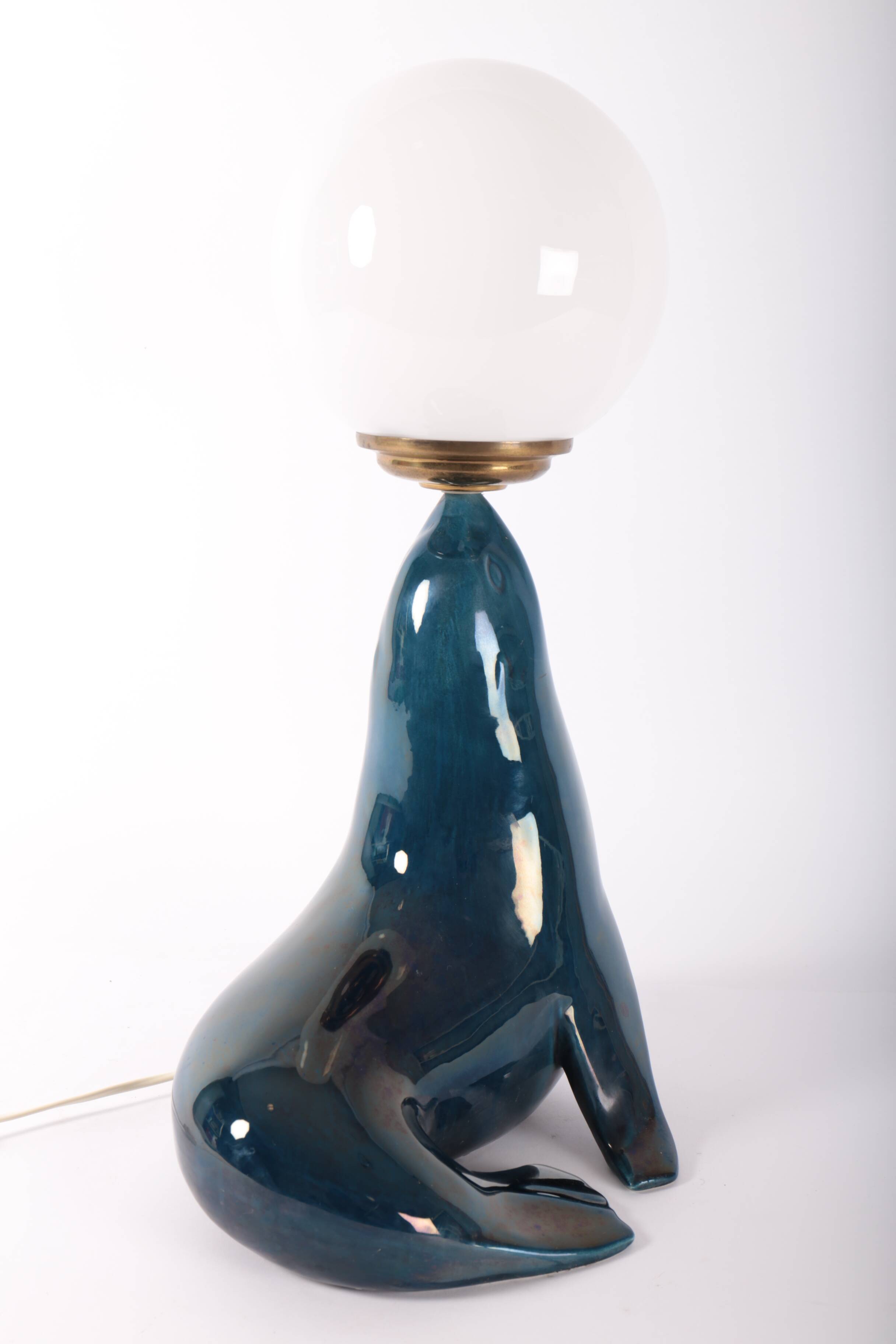Blue ceramic sea lion lamp