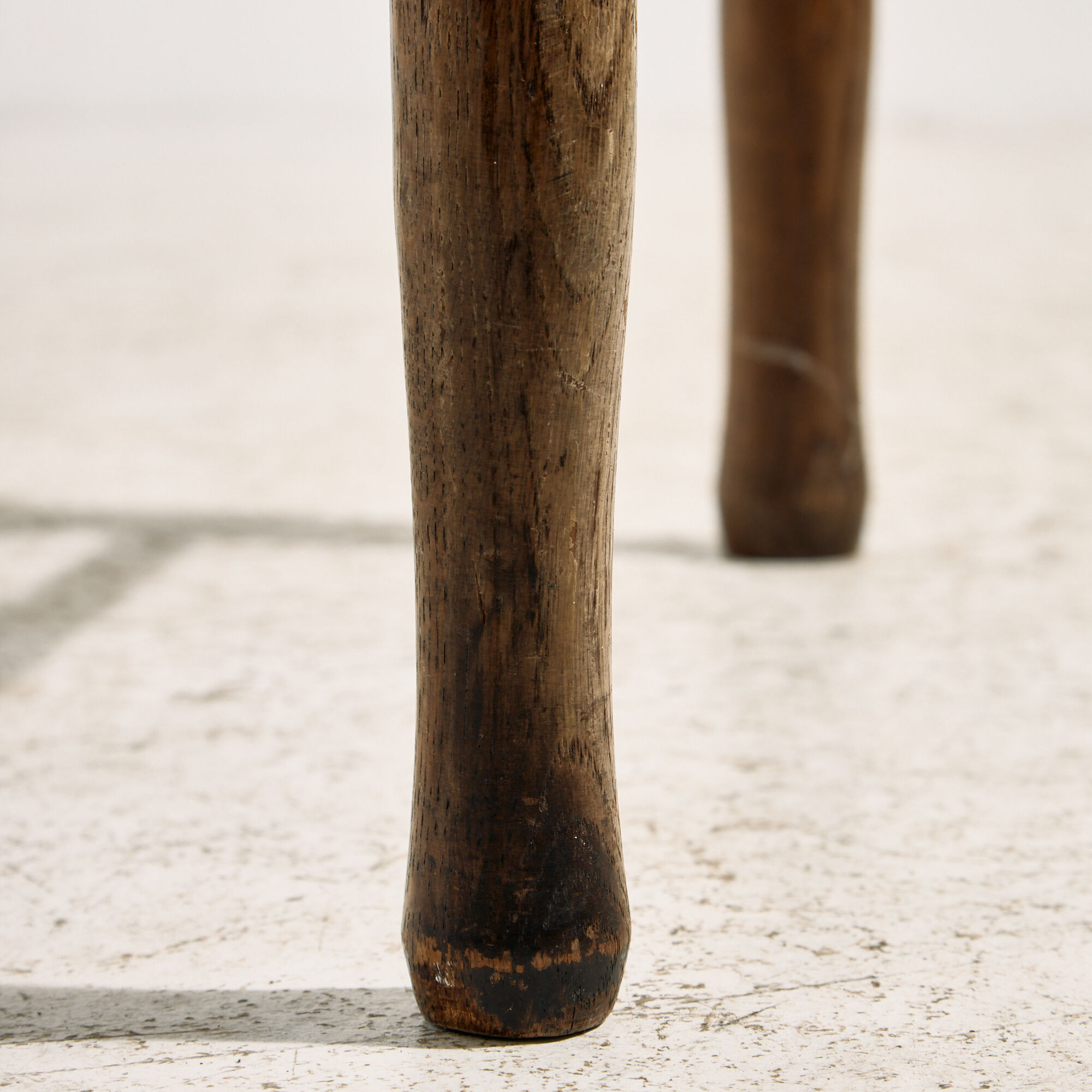 Oak armchair with three legs