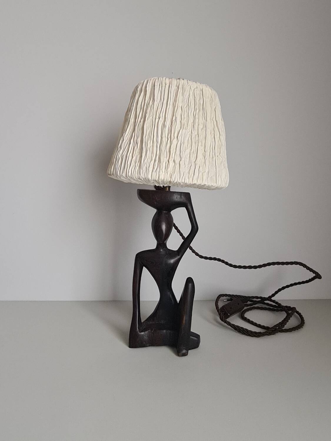 Ebony lamp with seated woman / 1930s