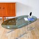 Oval coffee table in smoked glass and chrome, original double S design base, 1970.
