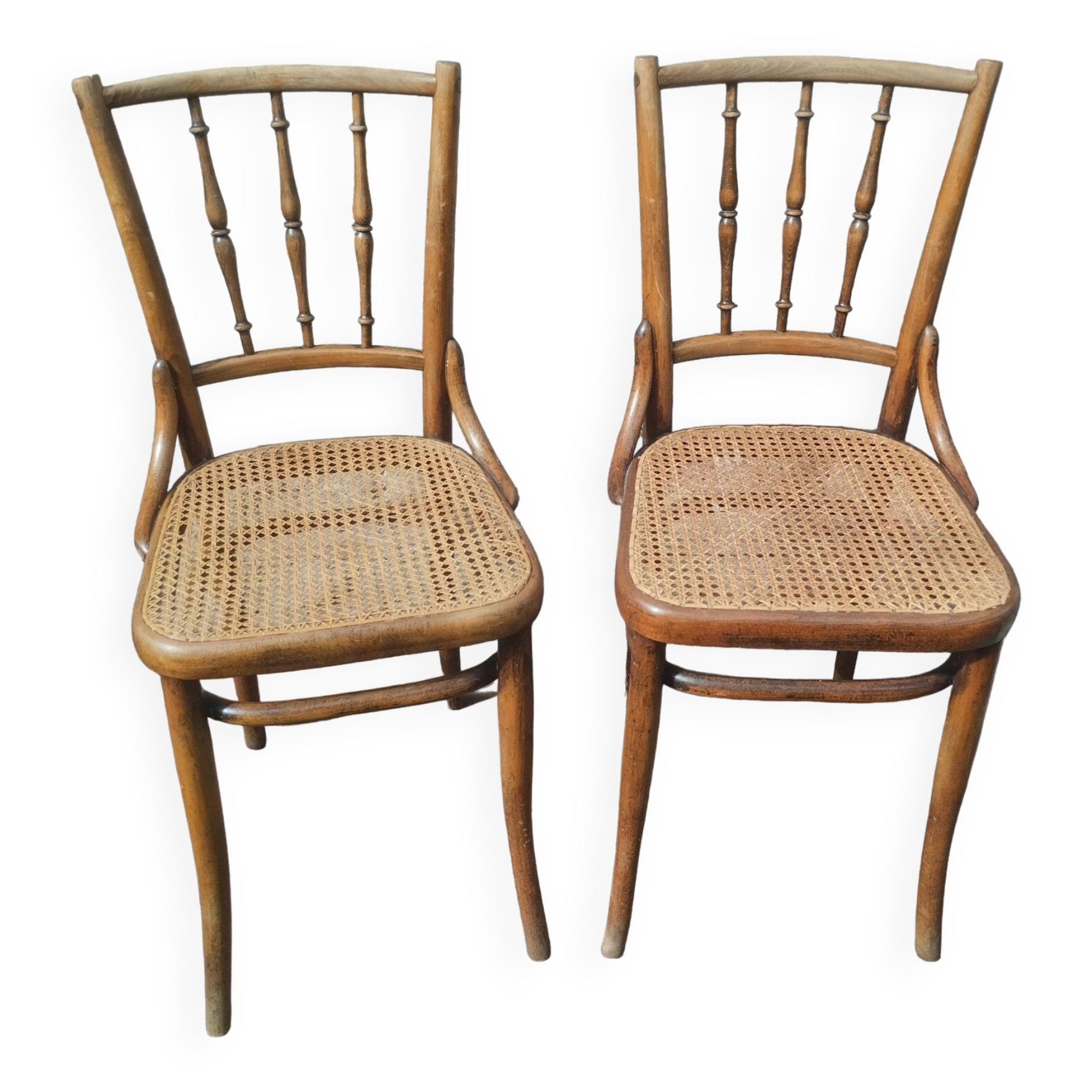 Set of 2 antique bistro chairs. Curved and turned wood.