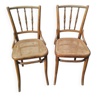 Set of 2 antique bistro chairs. Curved and turned wood.