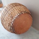 Vintage vase in sandstone and straw wicker