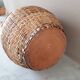 Vintage vase in sandstone and straw wicker