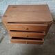 Small vintage Art Deco piece with 3 drawers, curved legs and caps.