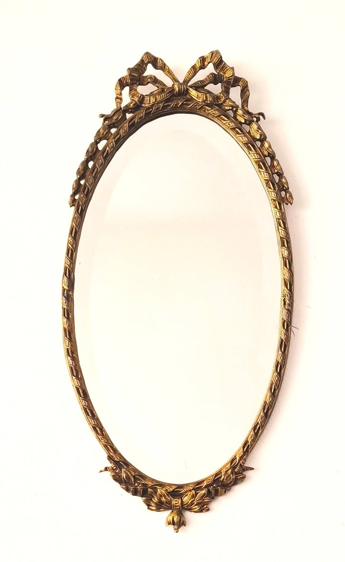 Bronze mirror in Hollywood Regency style from the 1940s/50s.
