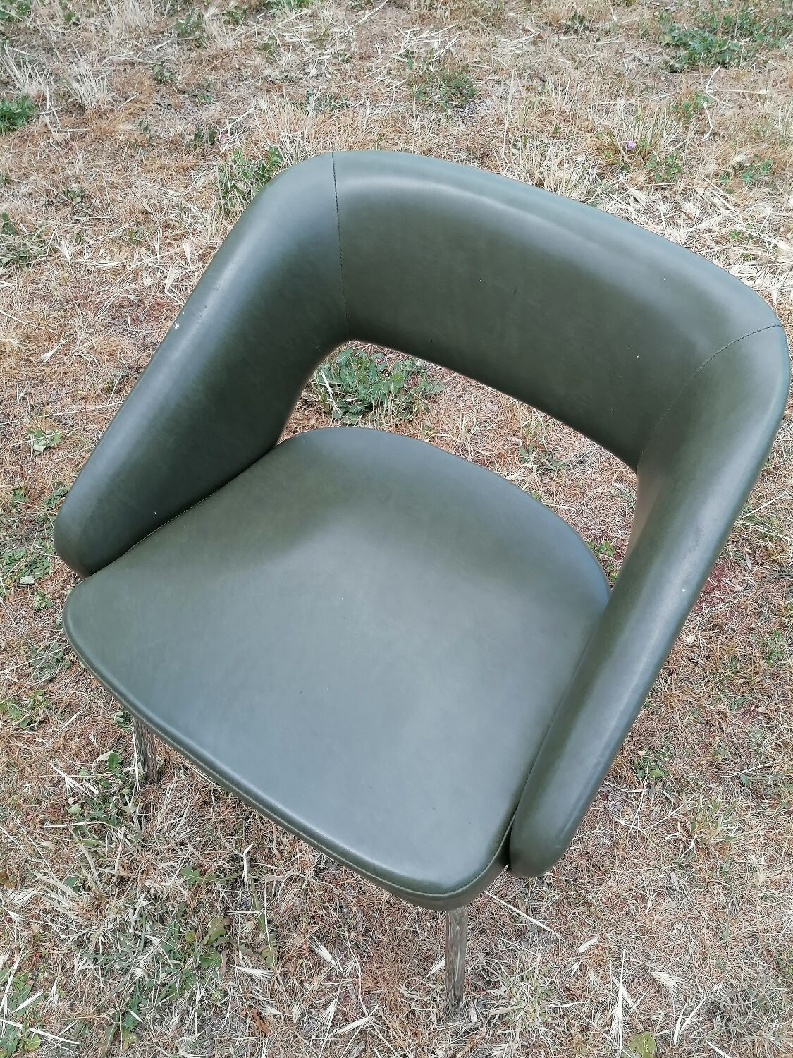 Vintage conference armchair in green skai Roset SNA