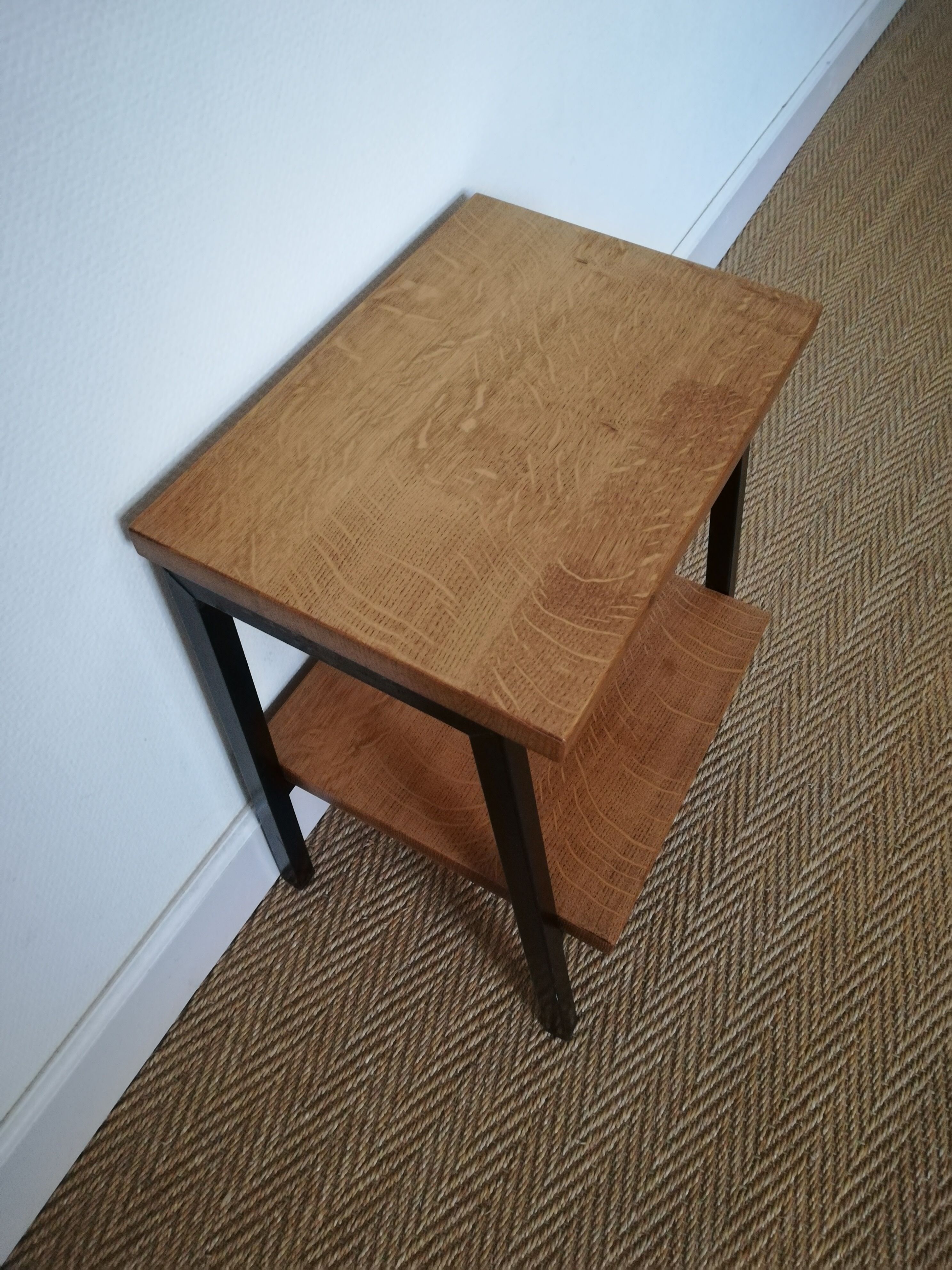A pair of bedside tables