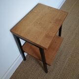 A pair of bedside tables
