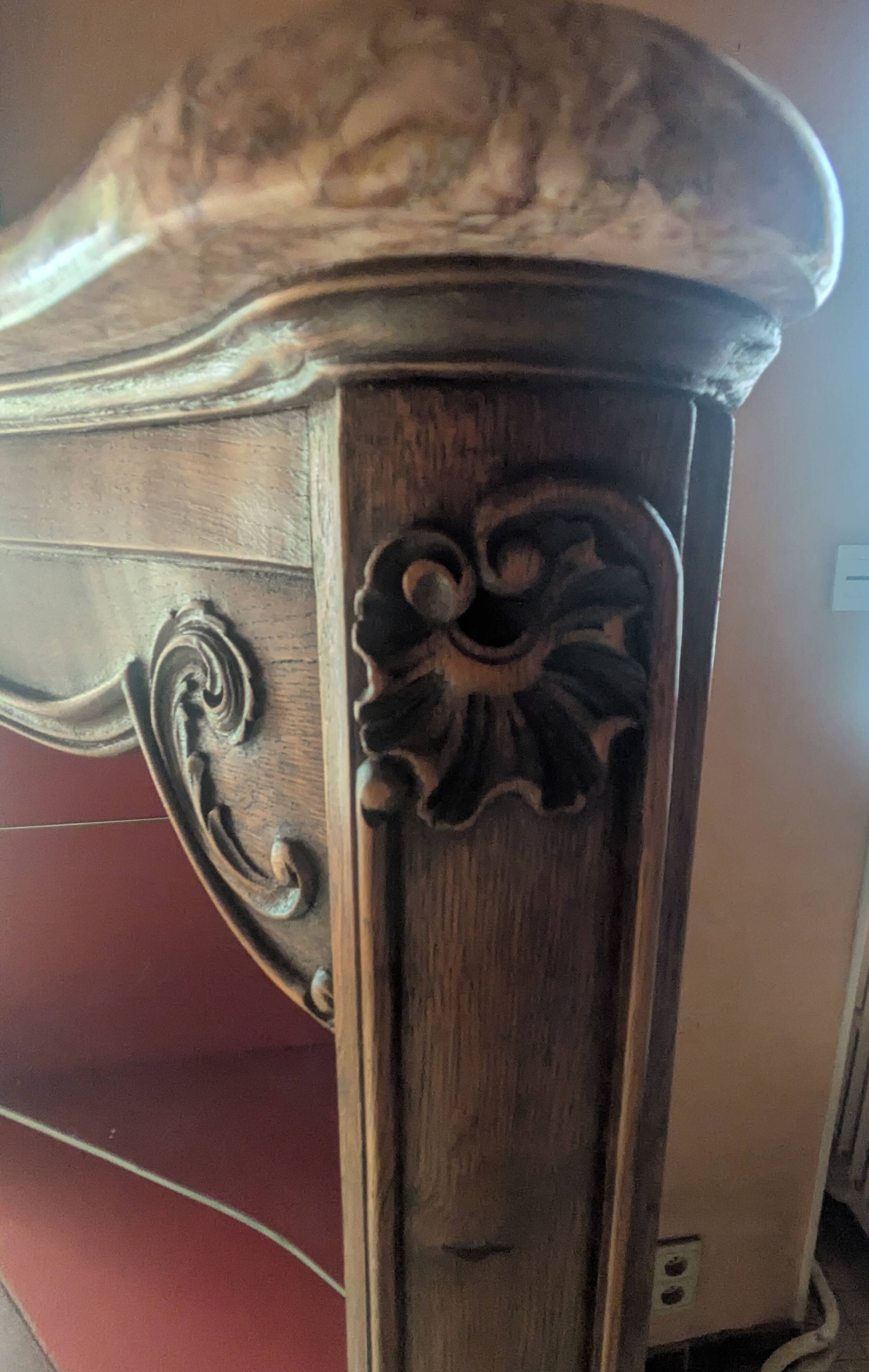 Antique corner cabinet in Louis XV style, topped with a marble surface.