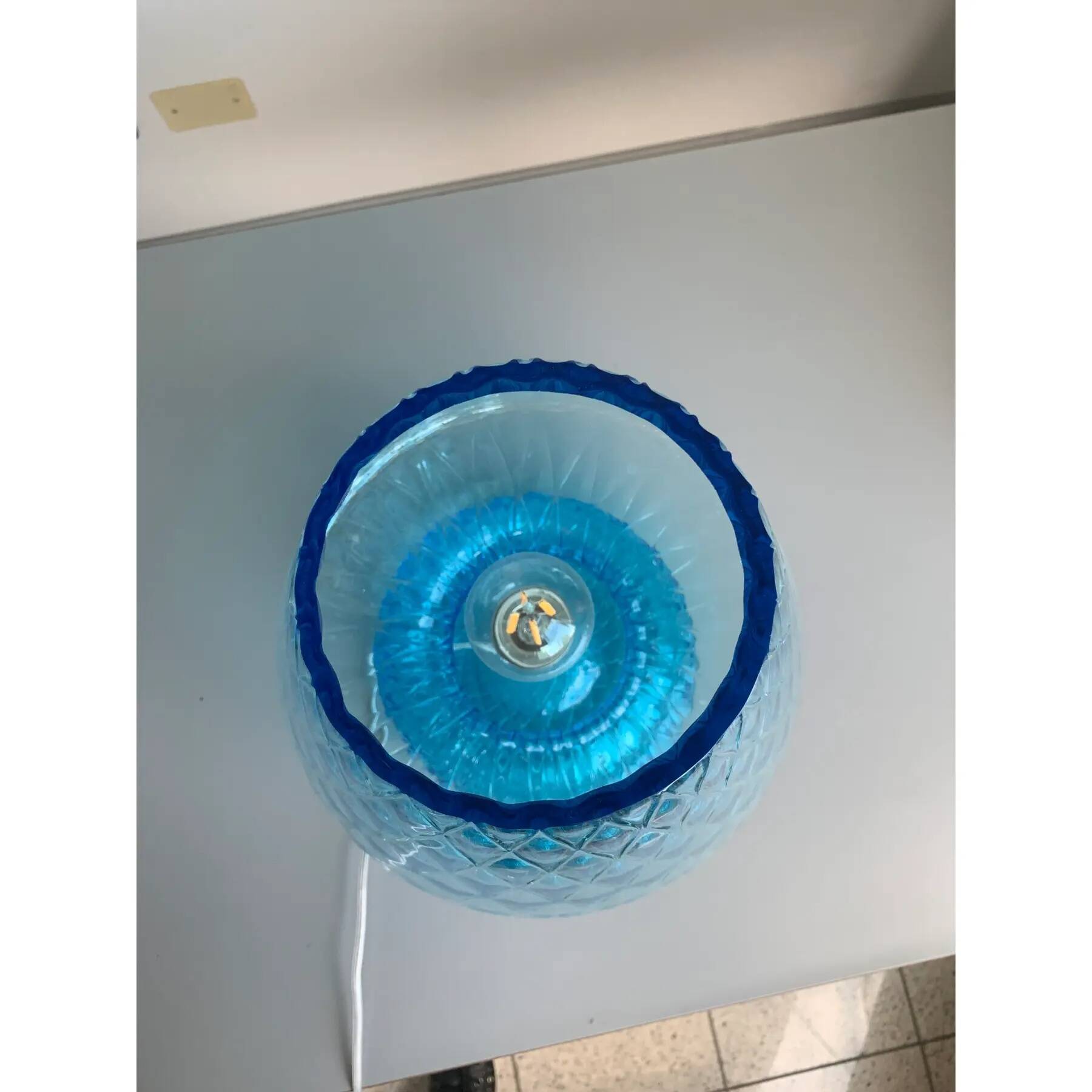 Light blue Murano-style glass with a balloton lamp.