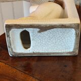 Pair of greenhouse art-deco books about cracked earthenware bird