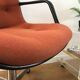 Vintage orange armchair model 451 with wheels by Steelcase Strafor, design by Randall Buck