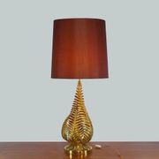 Lamp to lay on the foliage of golden ferns