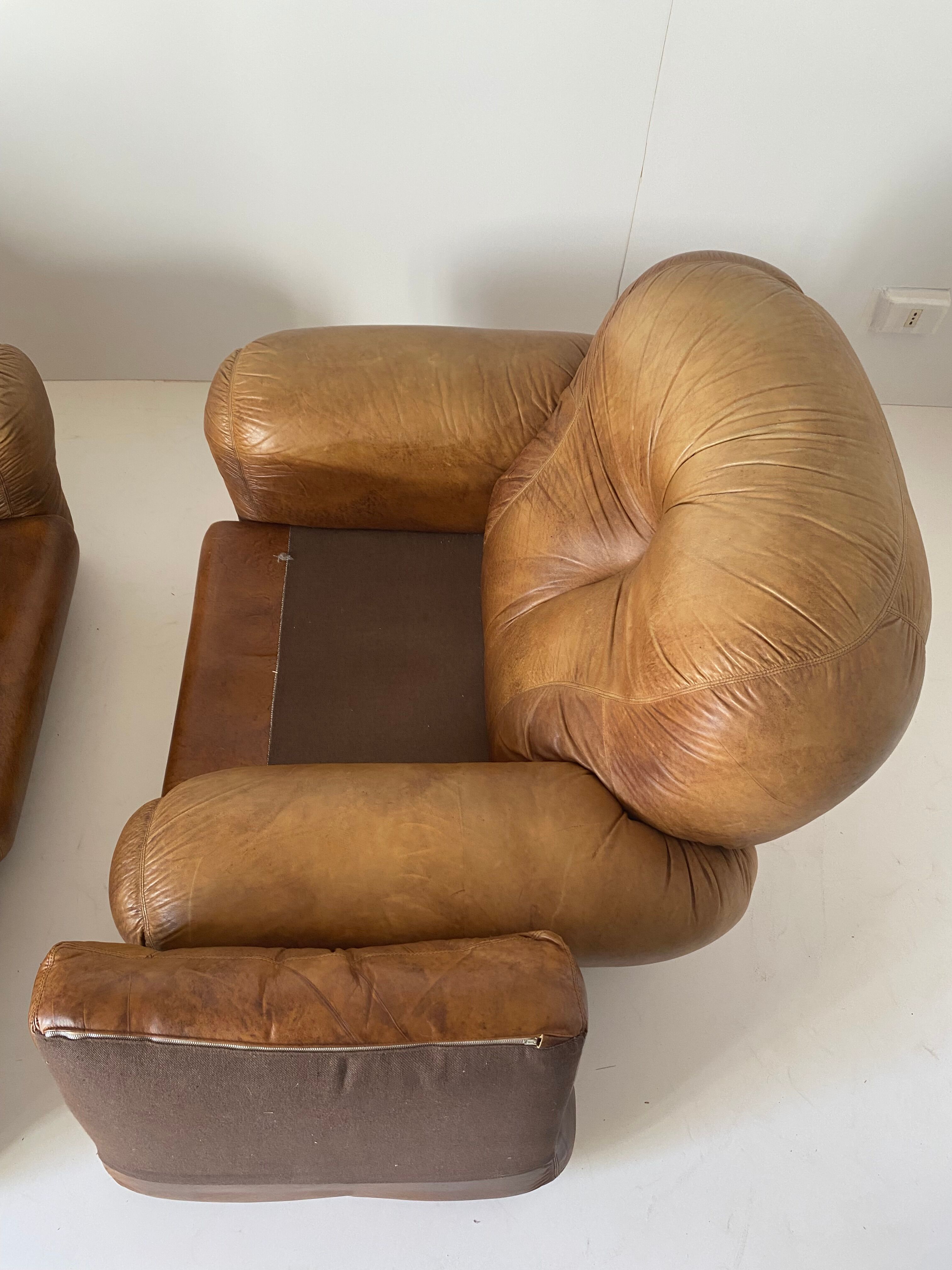 Pair of brown leather armchairs