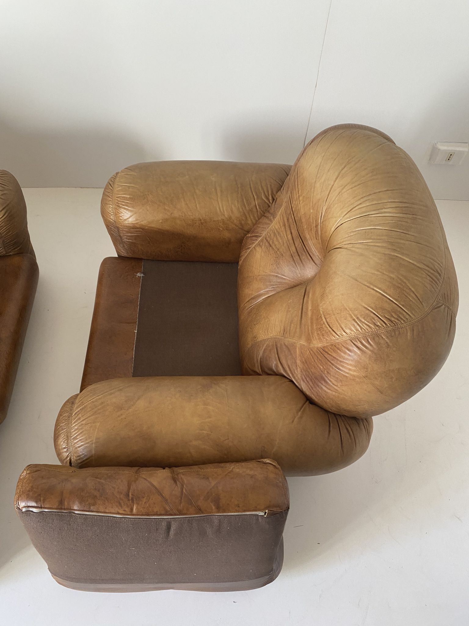 Pair of brown leather armchairs