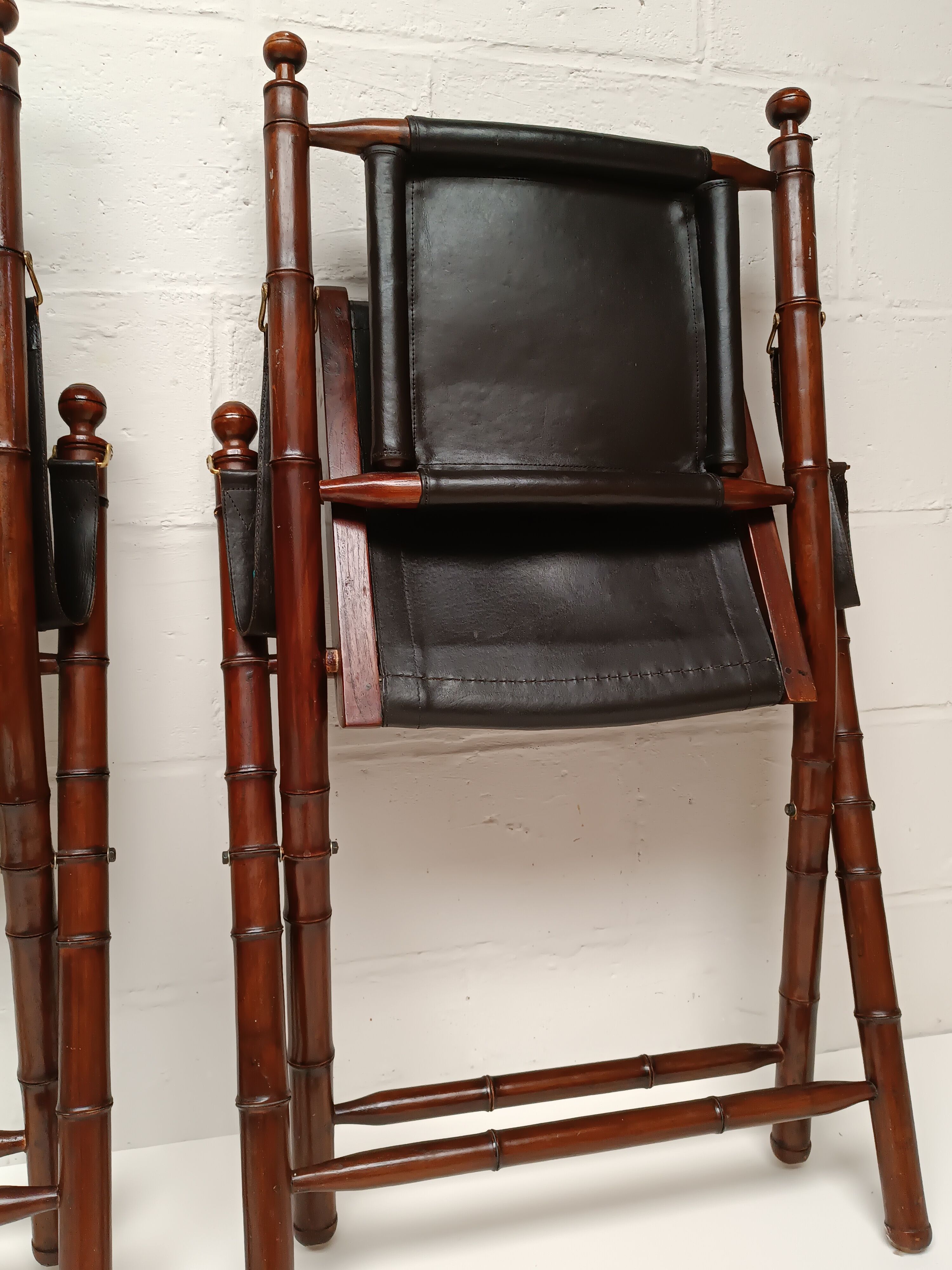 Pair of vintage "safari" folding armchairs in mahogany and leather
