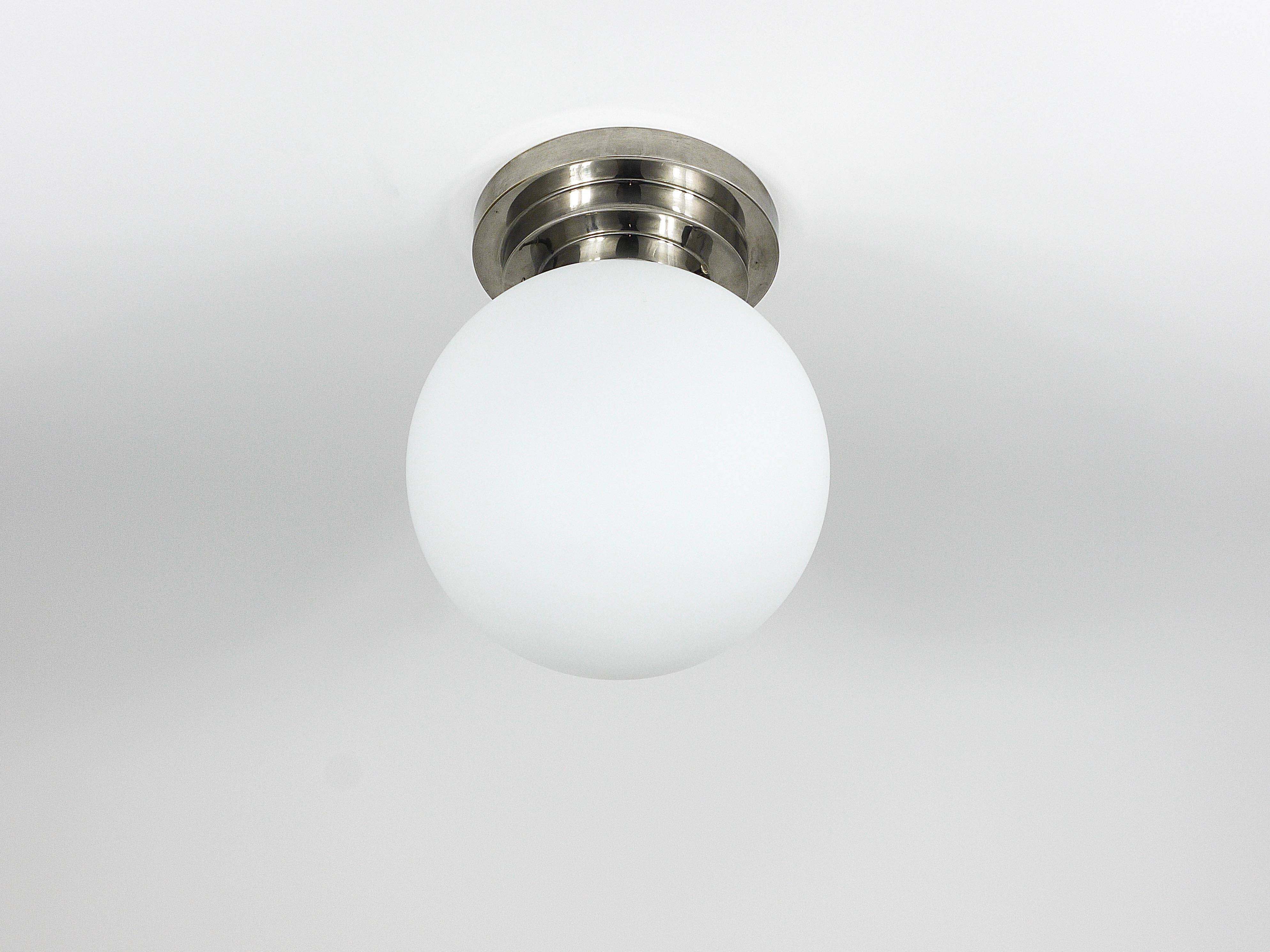 Large opaline glass globe ceiling lamp in Art Deco style.