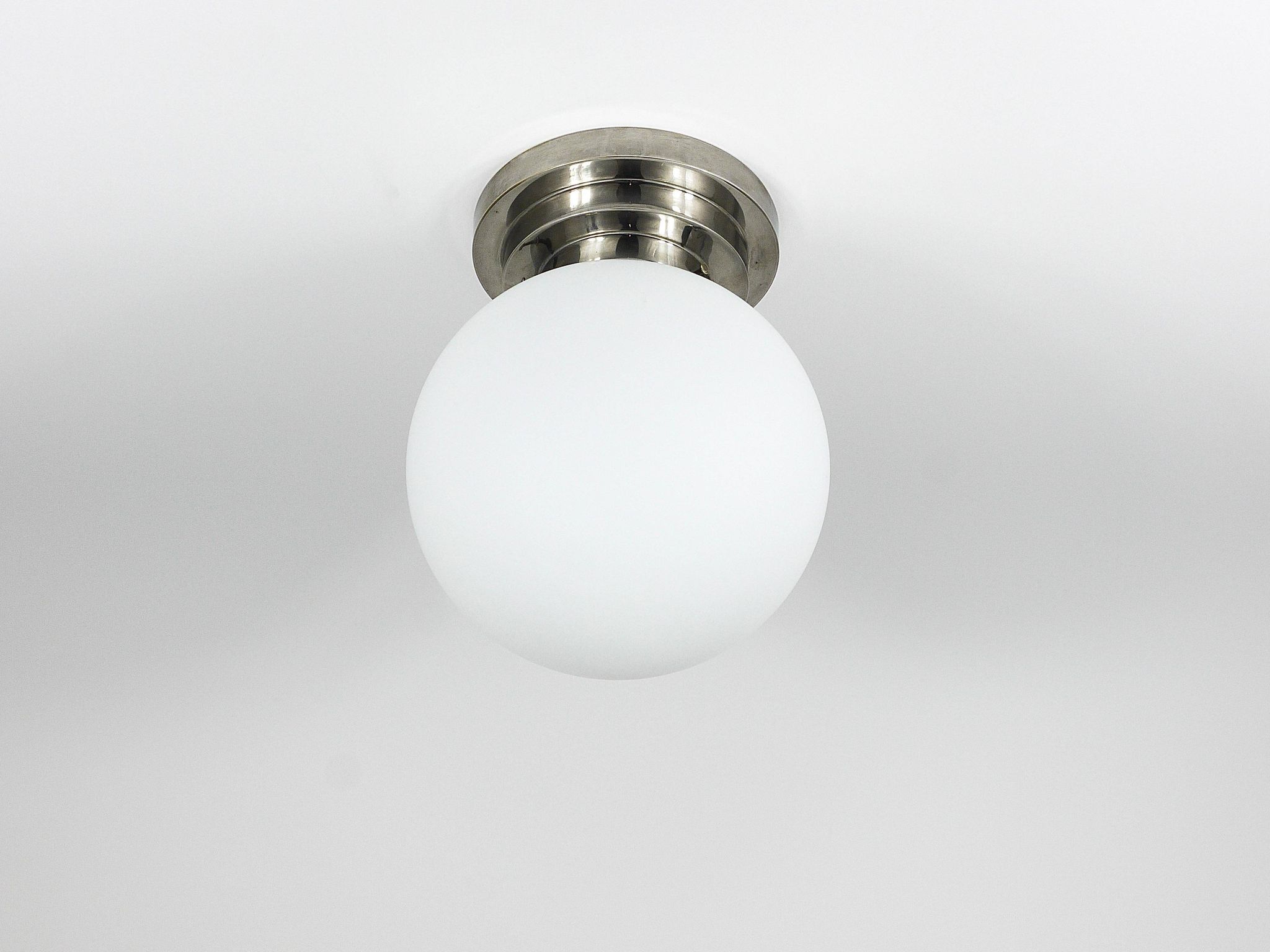 Large opaline glass globe ceiling lamp in Art Deco style.