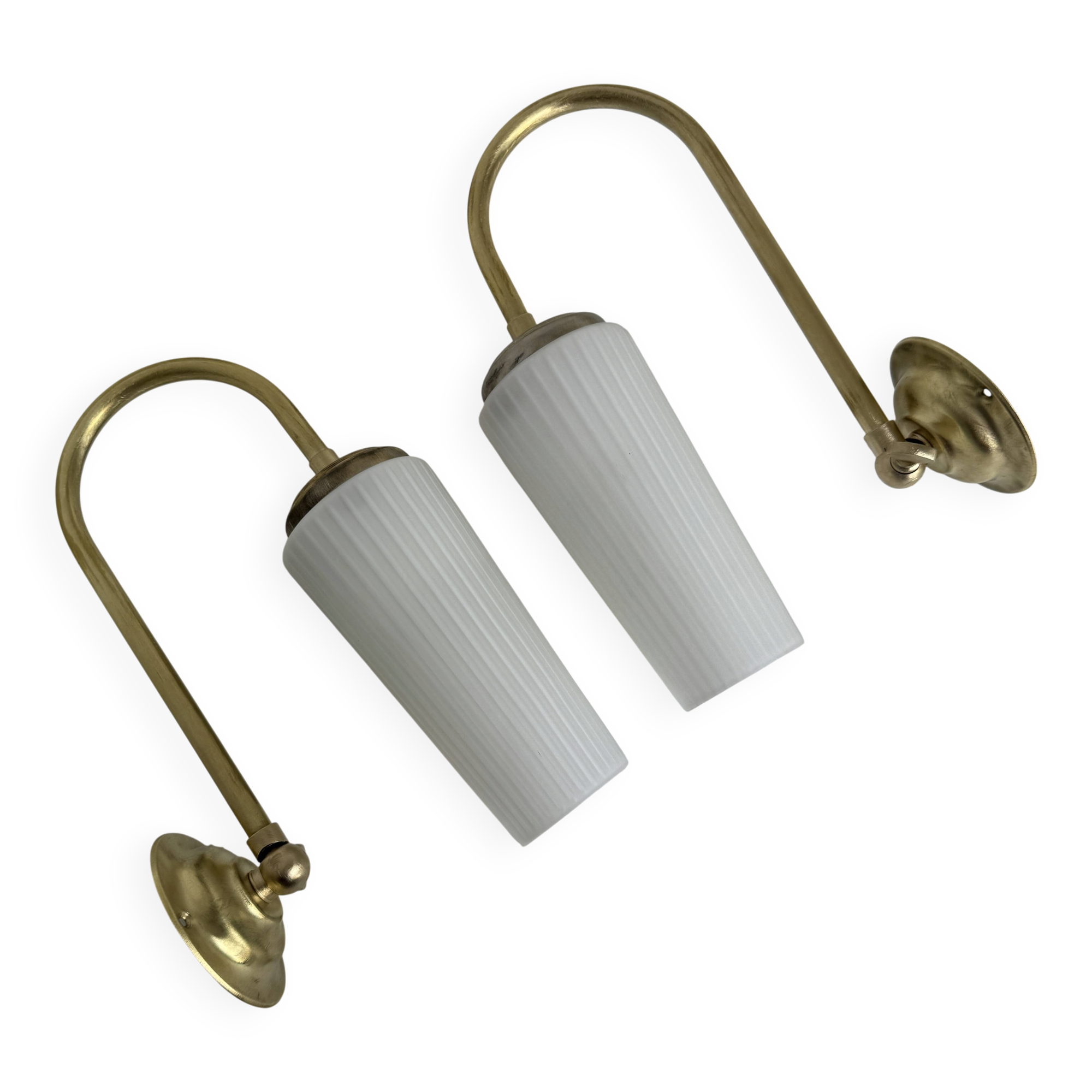 A pair of vintage opaline and brass wall lights