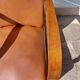 Low armchair, brown imitation leather