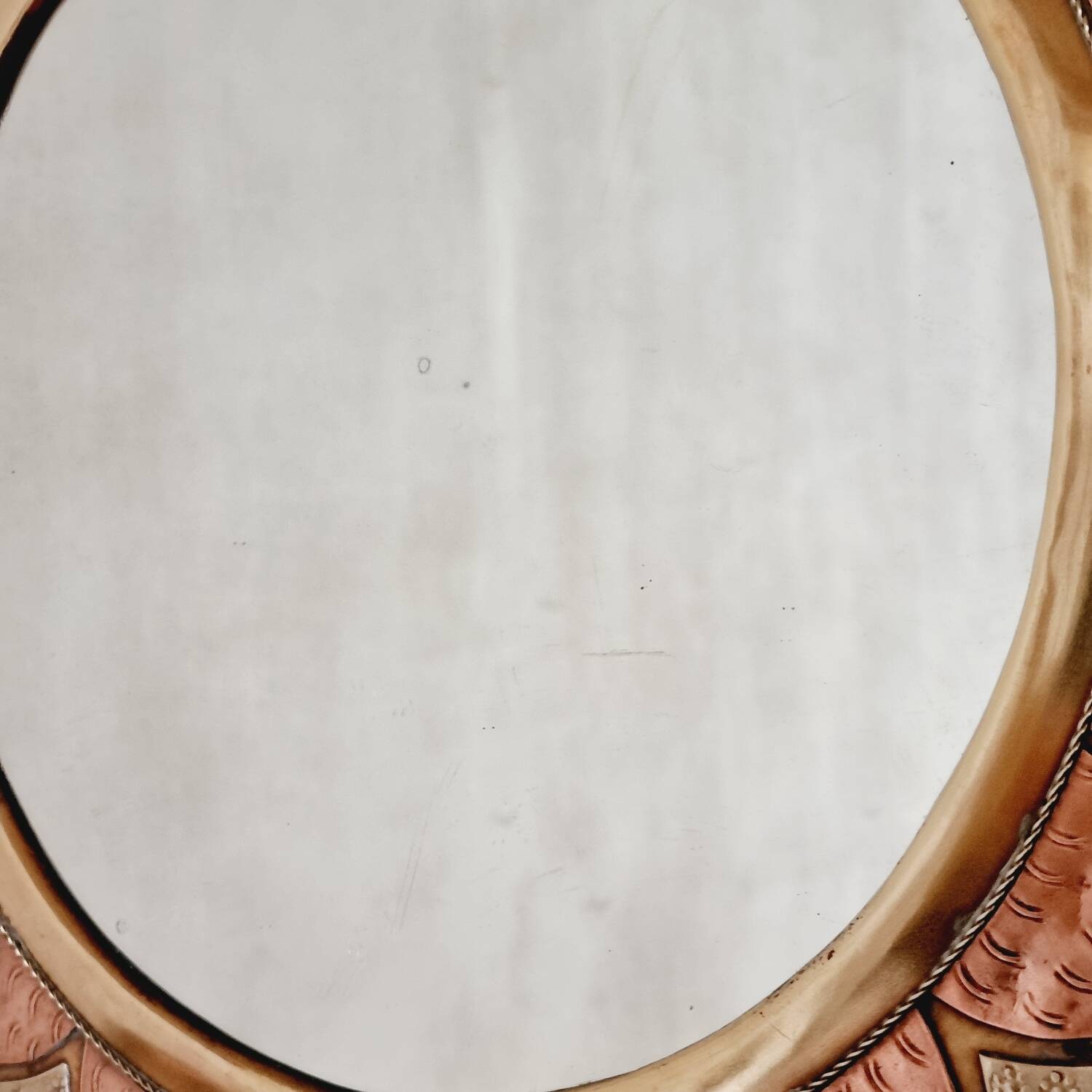 Round brass and copper mirror