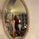 Large old oval mirror with beige patina wooden frame early 20th century